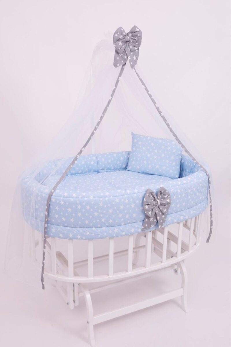 White Swingable Cradle with blue bedding
